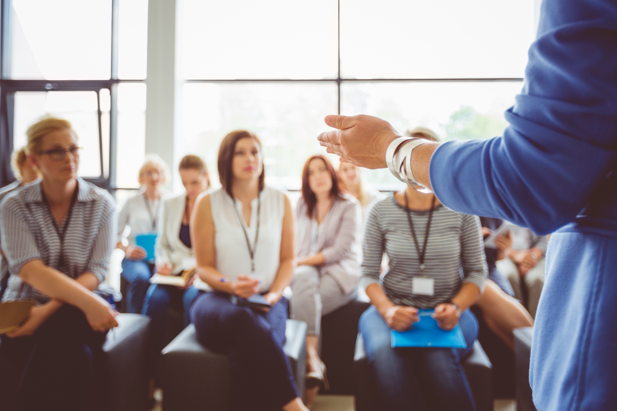 An instructor addressing adult learners in a training class